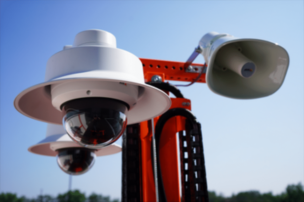 Angle view looking up at a mobile CCTV unit, highlighting its camera